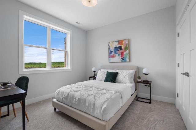 bedroom with light carpet