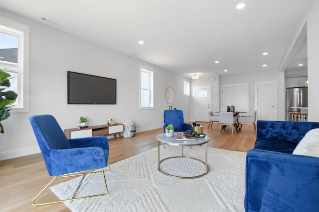 living room featuring light wood-type flooring