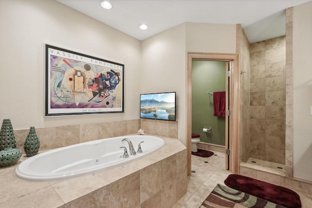 bathroom featuring separate shower and tub and toilet