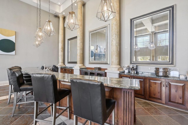 dining space with decorative columns