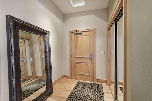 doorway to outside with light hardwood / wood-style floors