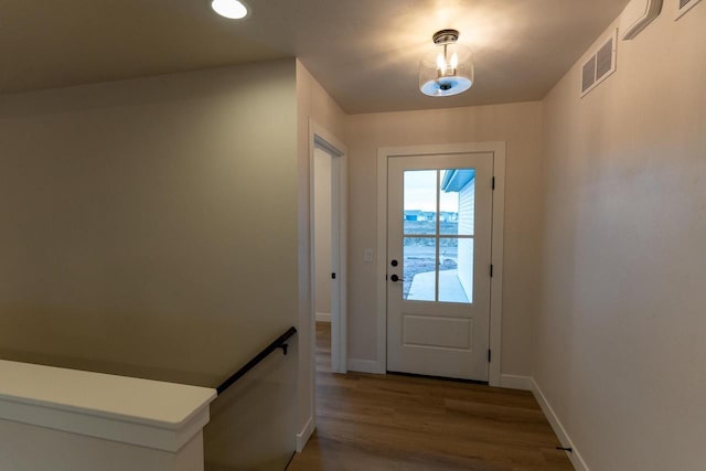 doorway to outside with wood-type flooring