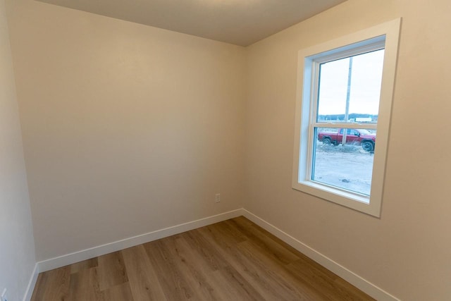 spare room featuring light wood-type flooring