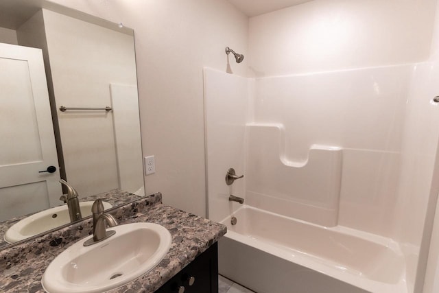 bathroom with bathing tub / shower combination and vanity