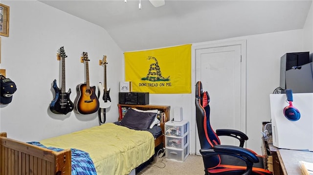 carpeted bedroom featuring lofted ceiling