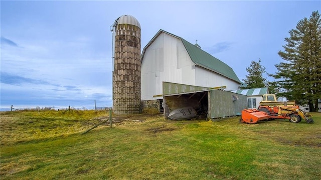 view of outbuilding featuring a yard