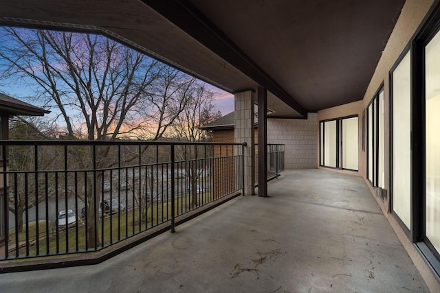 view of balcony at dusk