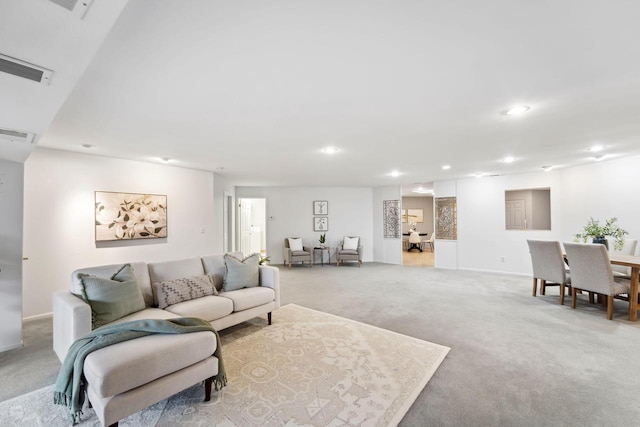 living room featuring light colored carpet