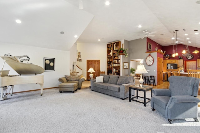 carpeted living room featuring ceiling fan and high vaulted ceiling