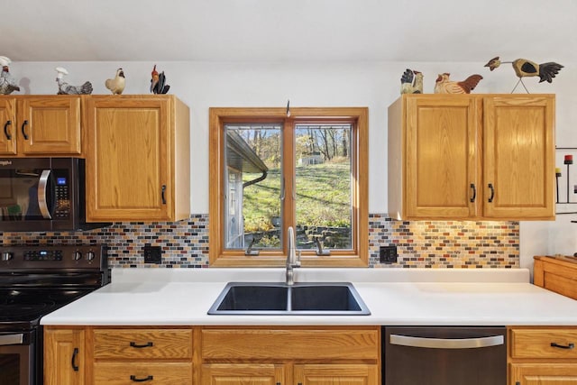 kitchen featuring sink, backsplash, and black appliances