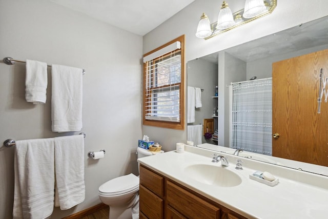 bathroom with vanity and toilet