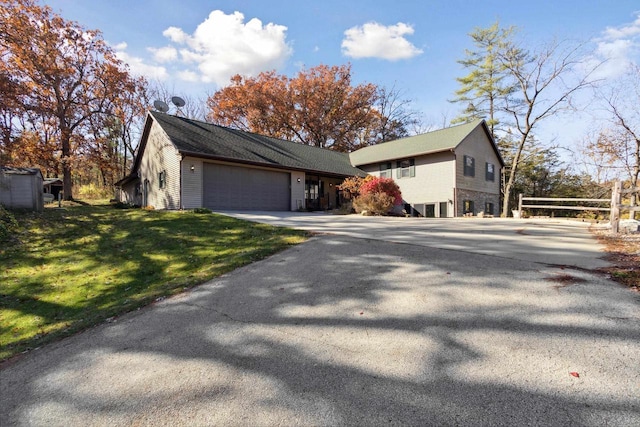 exterior space with a front yard and a garage