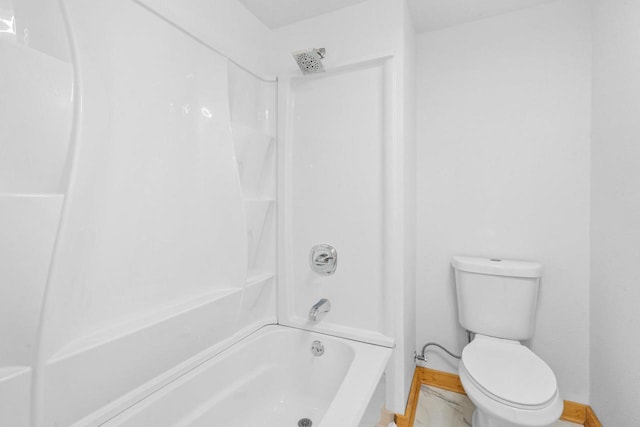 bathroom featuring shower / tub combination and toilet