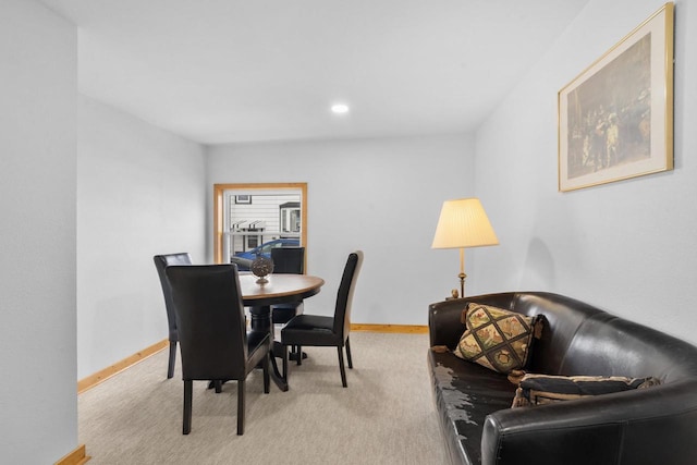 dining area with light colored carpet