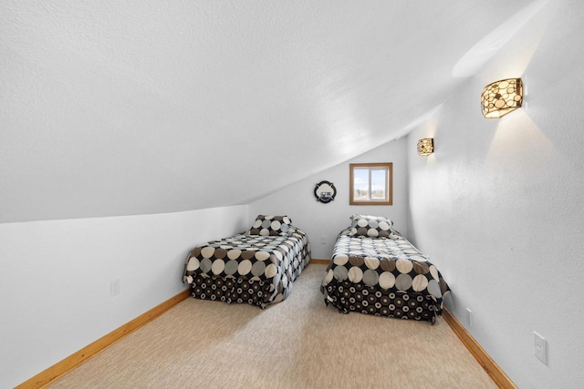 carpeted bedroom featuring lofted ceiling