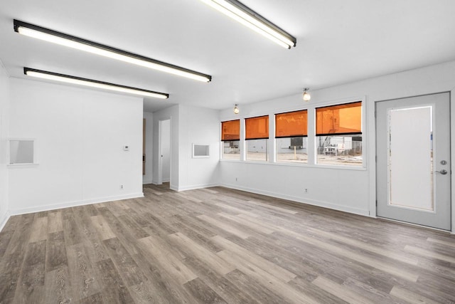 unfurnished living room featuring light wood-type flooring