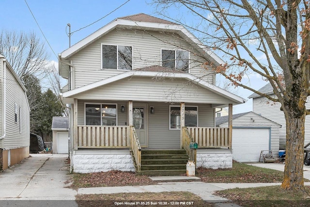 bungalow-style house with an outbuilding, a garage, and covered porch