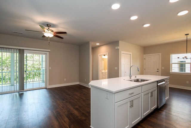 kitchen with a center island with sink, white cabinets, sink, ceiling fan, and decorative light fixtures