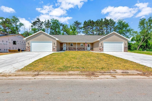 single story home with a front yard and a garage