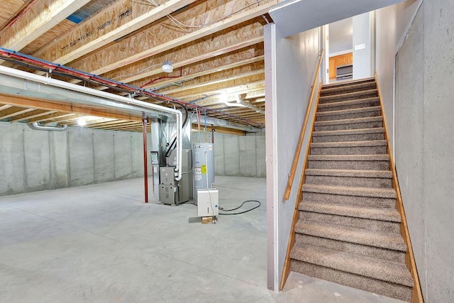 basement with heating unit and water heater