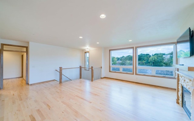 interior space featuring a fireplace and light hardwood / wood-style floors