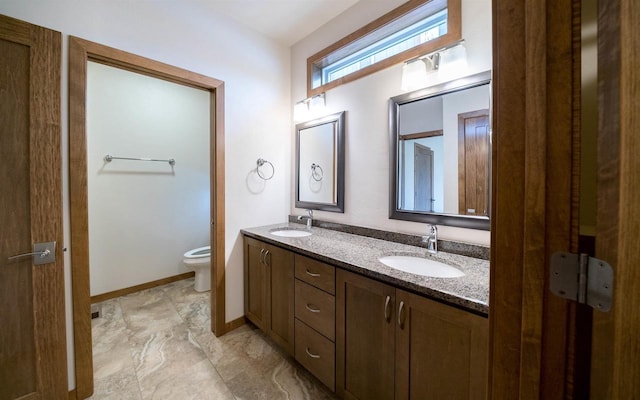 bathroom with vanity and toilet