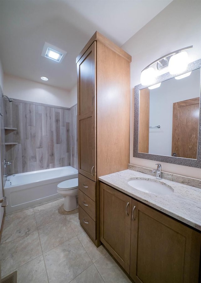 full bathroom with vanity, tiled shower / bath combo, and toilet