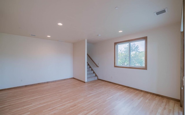 unfurnished room featuring light hardwood / wood-style flooring