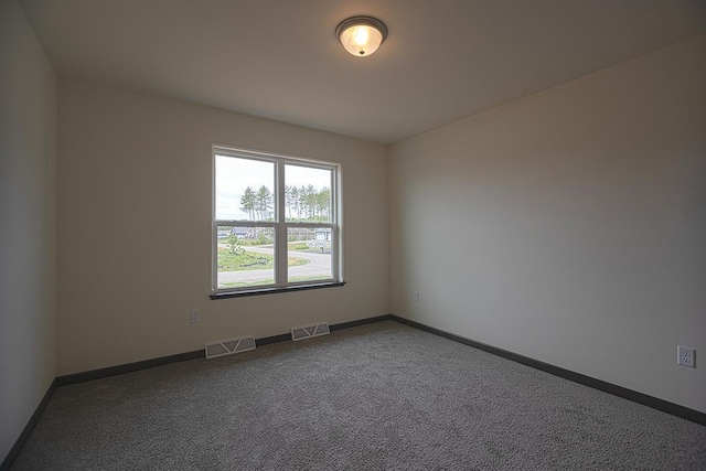 empty room featuring carpet floors