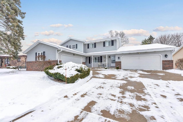 view of property featuring a porch and a garage