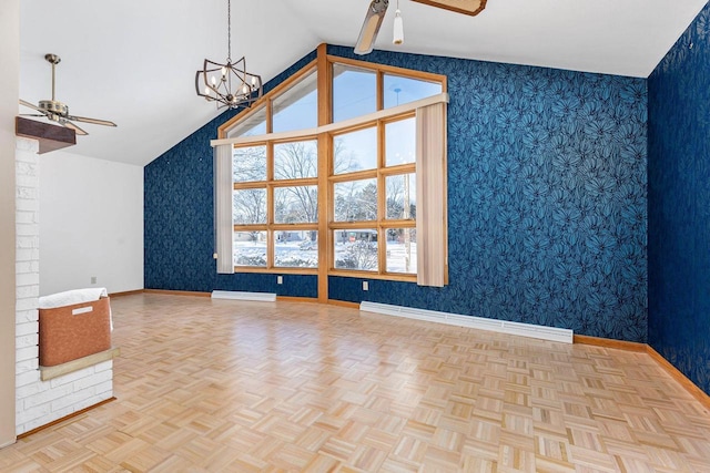 additional living space with ceiling fan with notable chandelier, a baseboard heating unit, vaulted ceiling, and light parquet flooring