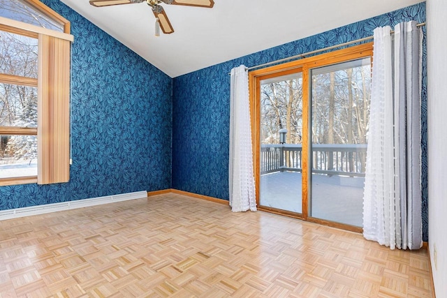 spare room featuring ceiling fan and light parquet floors