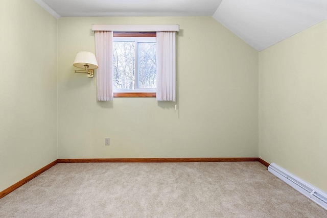 additional living space featuring baseboard heating, light carpet, and vaulted ceiling