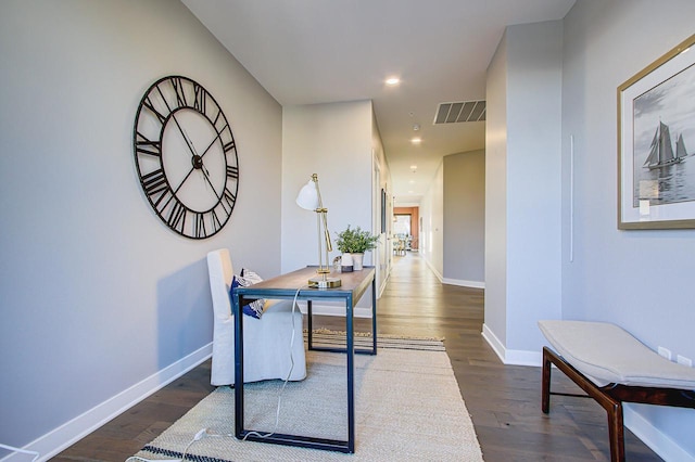 office with dark hardwood / wood-style floors