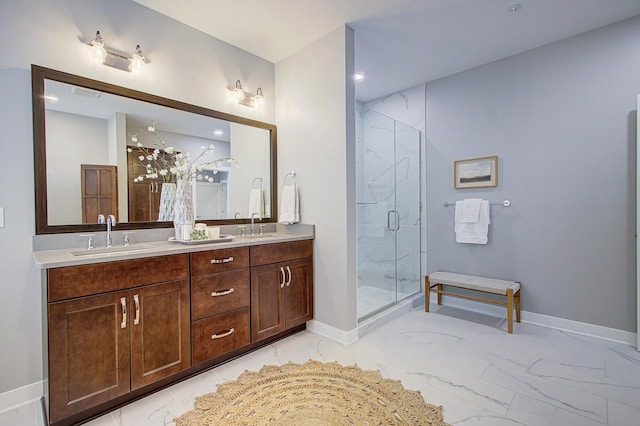 bathroom with vanity and a shower with shower door