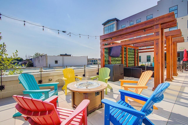 view of patio / terrace with a fire pit and a pergola