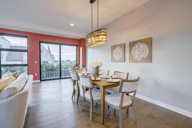 dining space with dark hardwood / wood-style floors