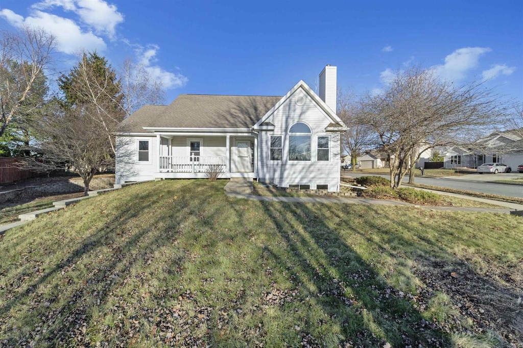 view of front of property with a porch and a front yard