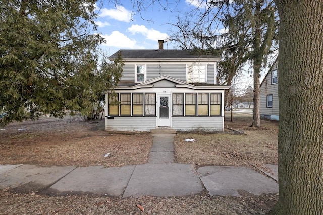 front facade featuring a sunroom