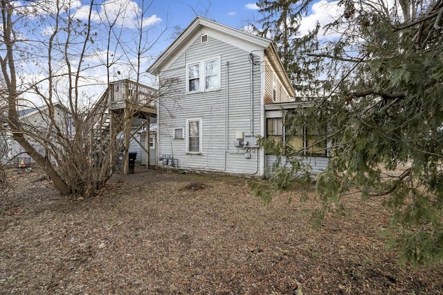 rear view of house with a deck