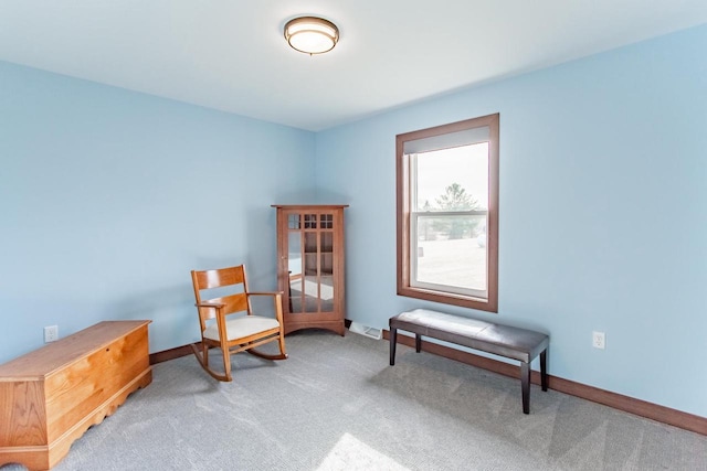 sitting room with light colored carpet