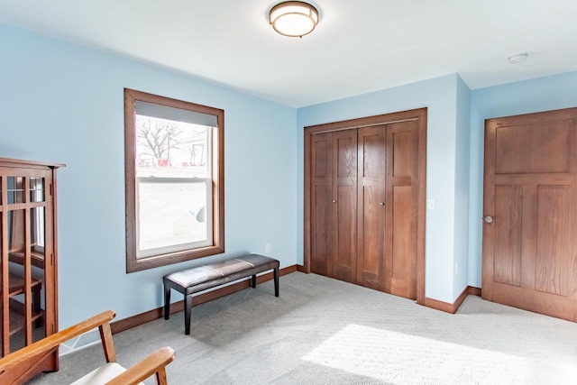 interior space featuring light carpet