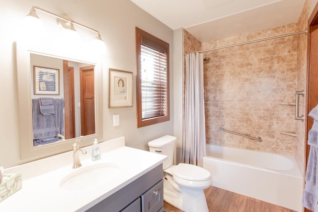 full bathroom featuring vanity, wood-type flooring, shower / tub combo, and toilet