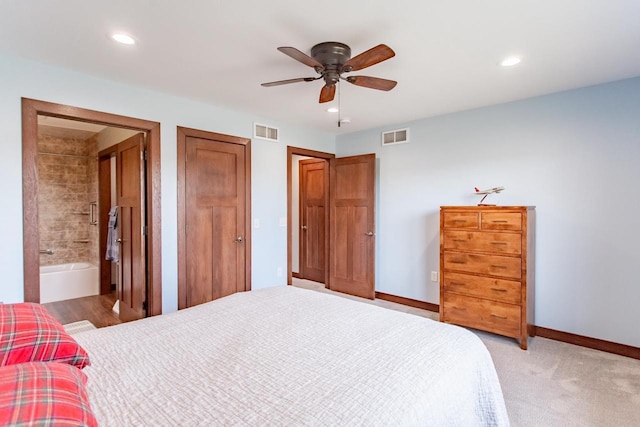 carpeted bedroom with ceiling fan and connected bathroom