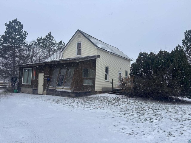 59005 Bill Anderson Rd, Mason, WI 54856 - view of snowy exterior featuring metal roof