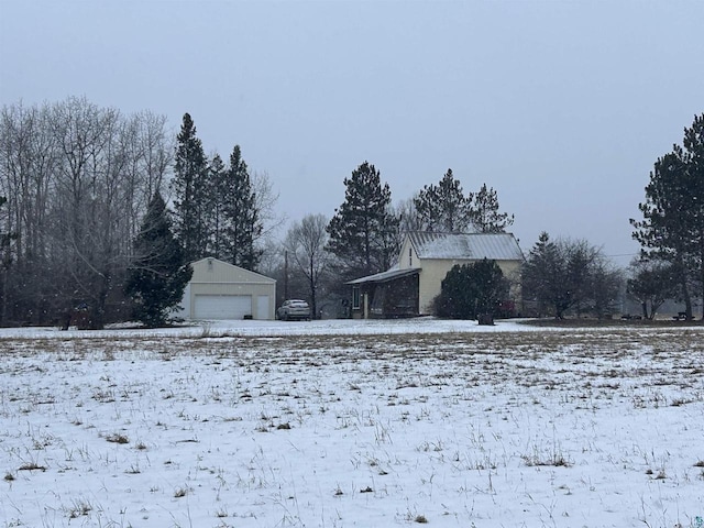 59005 Bill Anderson Rd, Mason, WI 54856 - snowy yard with a garage and an outbuilding