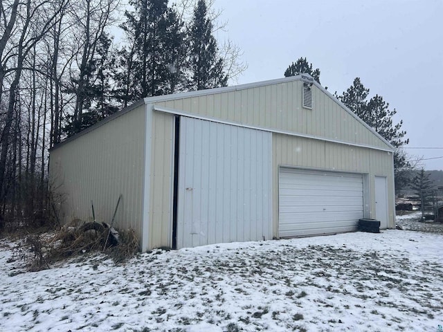 view of snow covered garage