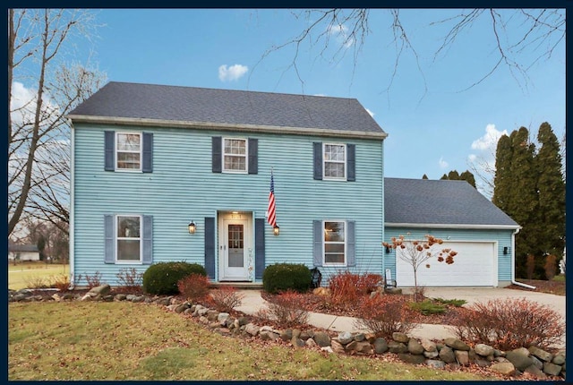 colonial inspired home featuring a garage