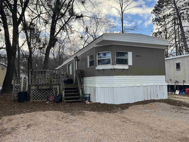 view of home's exterior featuring a deck