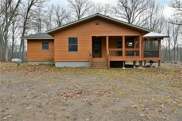 view of front of house featuring a sunroom